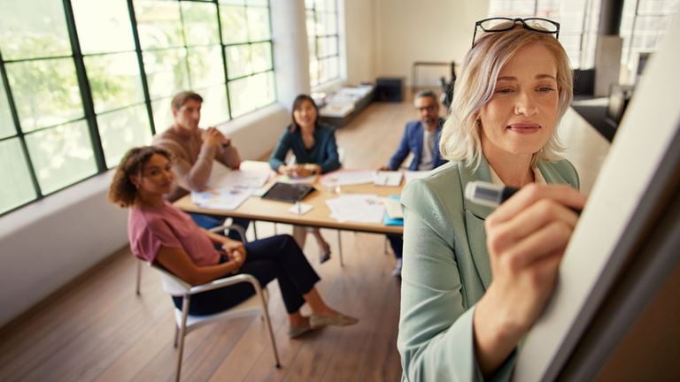 Business professionals collaborate on technology integration and digital transformation strategies.