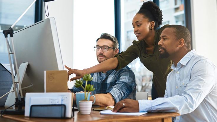 A group of coworkers evaluating how to find external auditors with industry experience