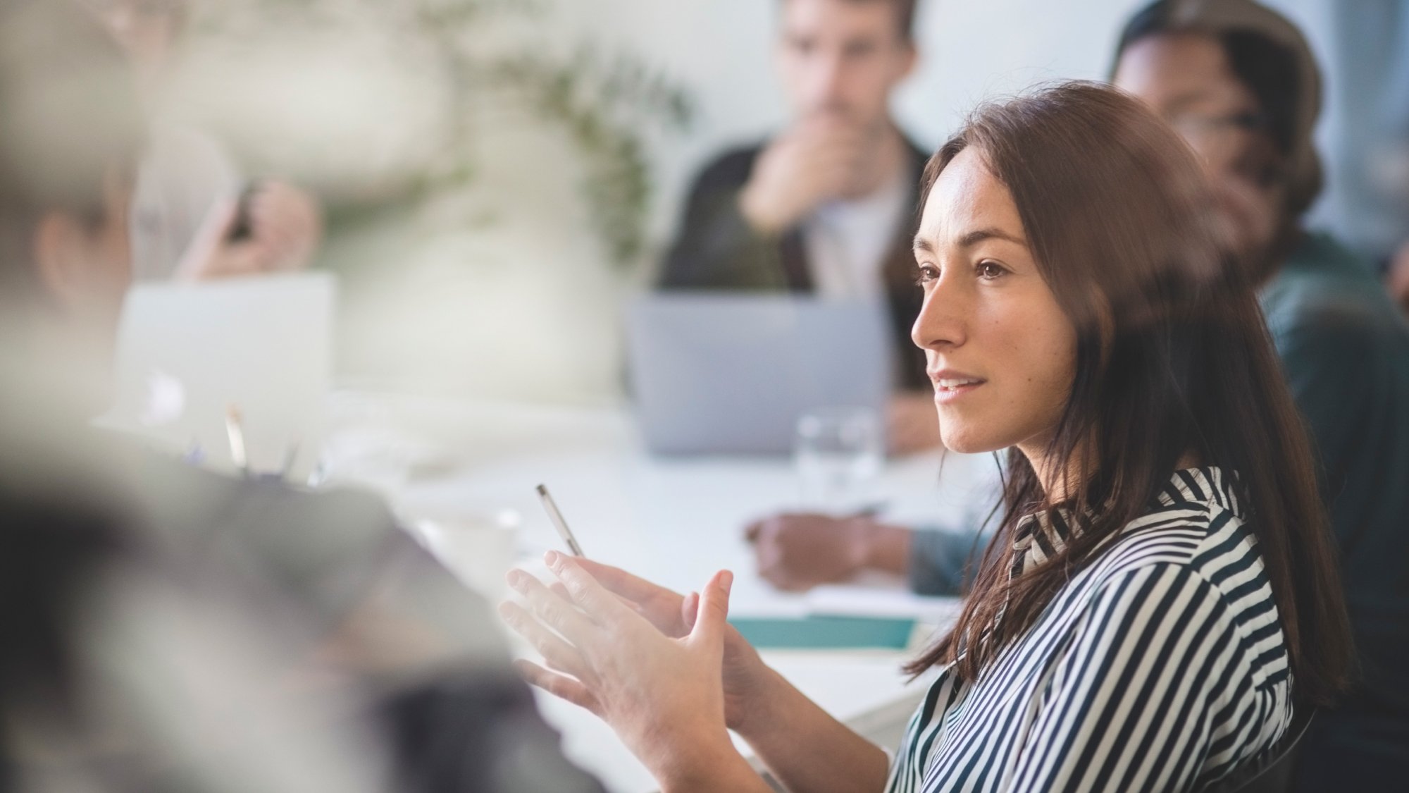 Lady in business meeting discusses discusses setting the approach for an internal AML audit