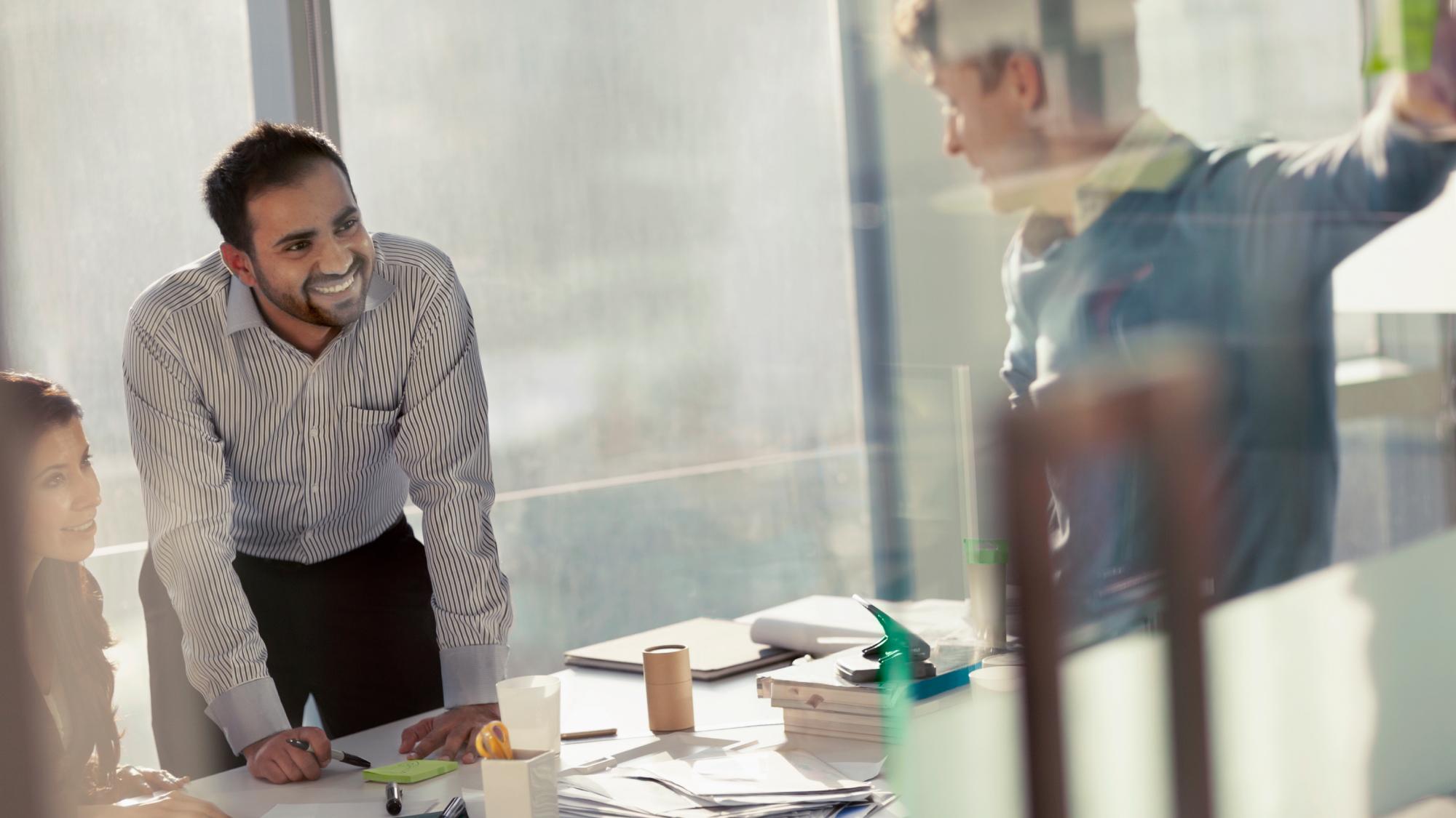 Internal auditors meeting to discuss the best starting point to find Bank Secrecy Act (BSA), AML resources, and regulatory updates