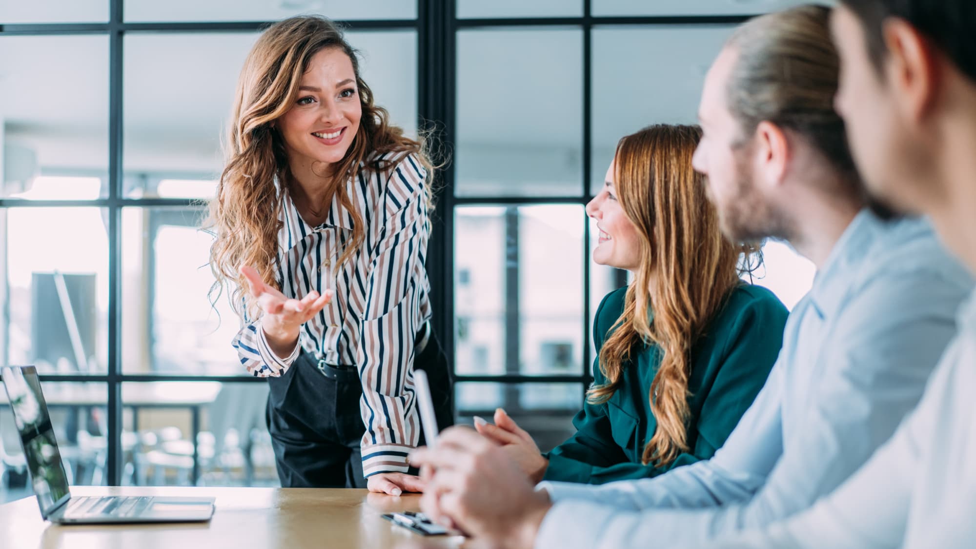 Consultant leads a discussion with government agency staff about cybersecurity, AI, and technology transformation.