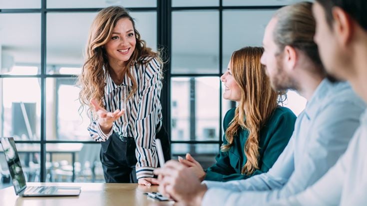 Consultant leads a discussion with government agency staff about cybersecurity, AI, and technology transformation.