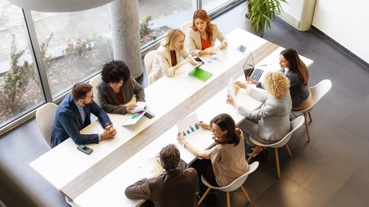 A team of professionals discussing the latest accounting standards from the foremost regulatory bodies.
