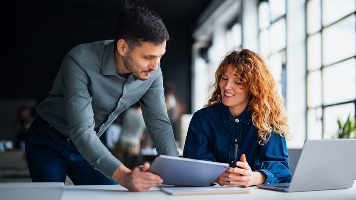 Professionals collaborating on digital tools to modernize lease accounting.