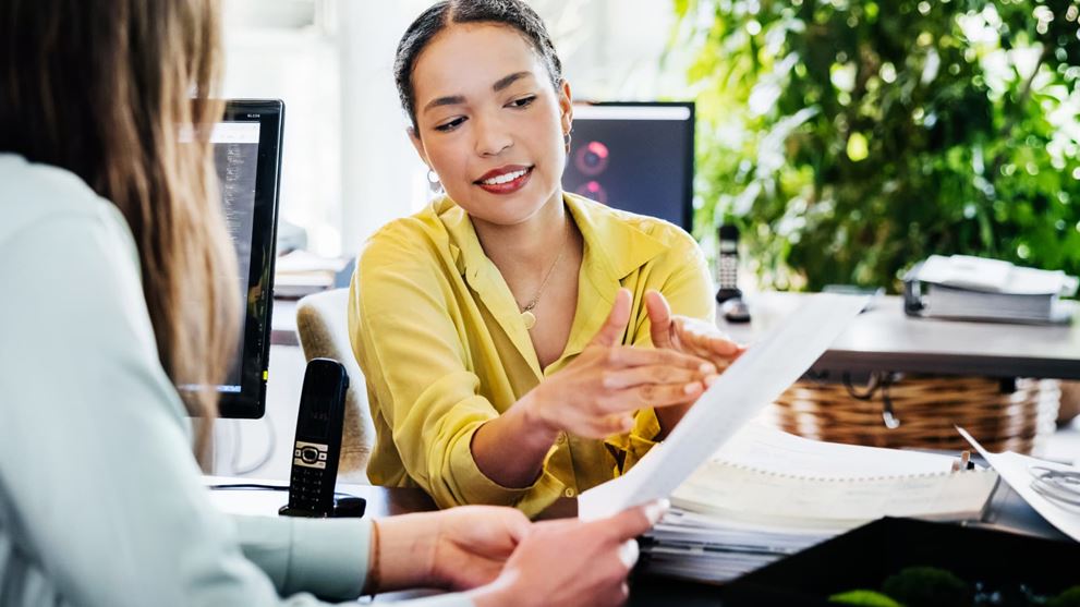 Crowe specialist reviews a document while discussing three successful 2025 public sector technology modernization initiatives.