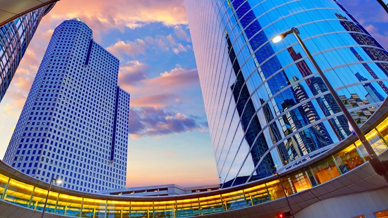Houston skyscrapers at sunset, reflecting the city’s business landscape