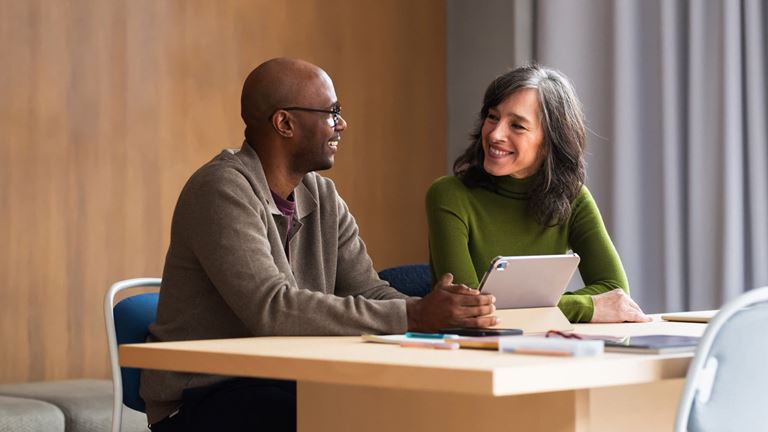 Business leaders collaborate on technology and cybersecurity strategy.