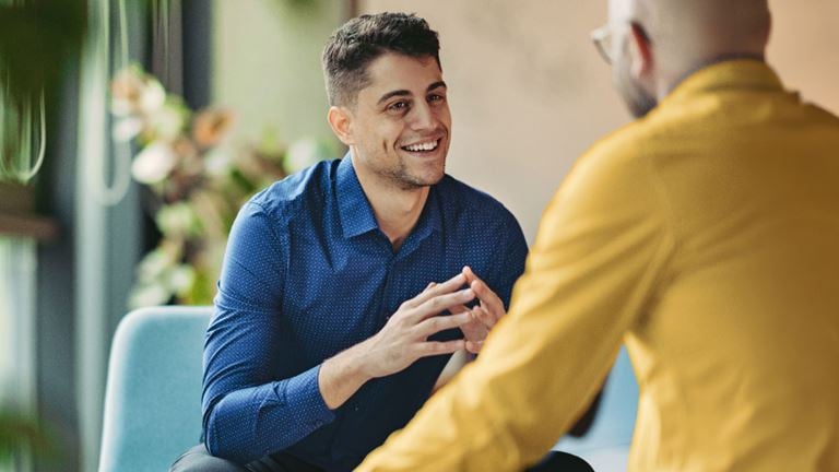Two professionals discuss regulatory compliance and business resilience.