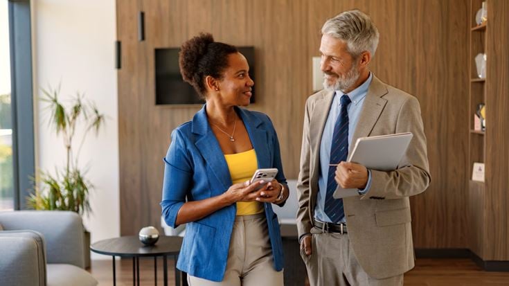Business professionals discuss regulatory developments and financial industry updates.