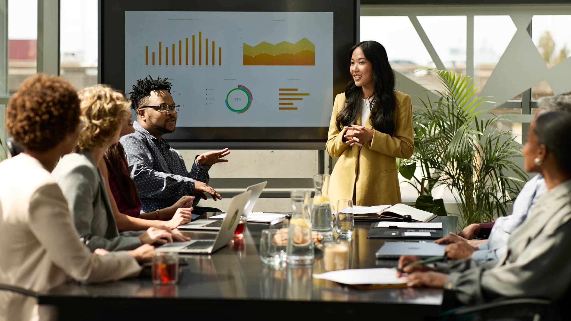 A woman presents to an audience, emphasizing the importance of diligence in managing financial crime risk.