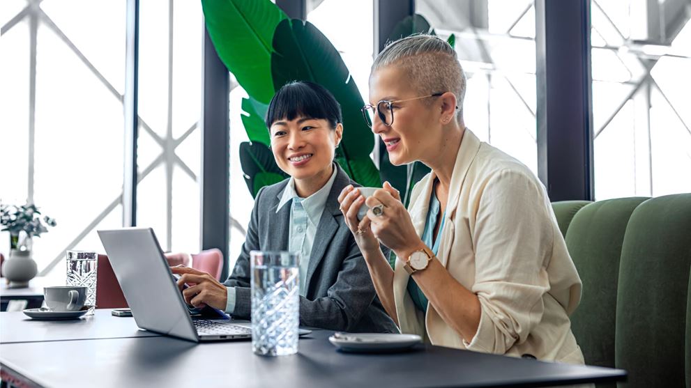 Business professionals review reporting insights to support informed decisions and stronger governance.