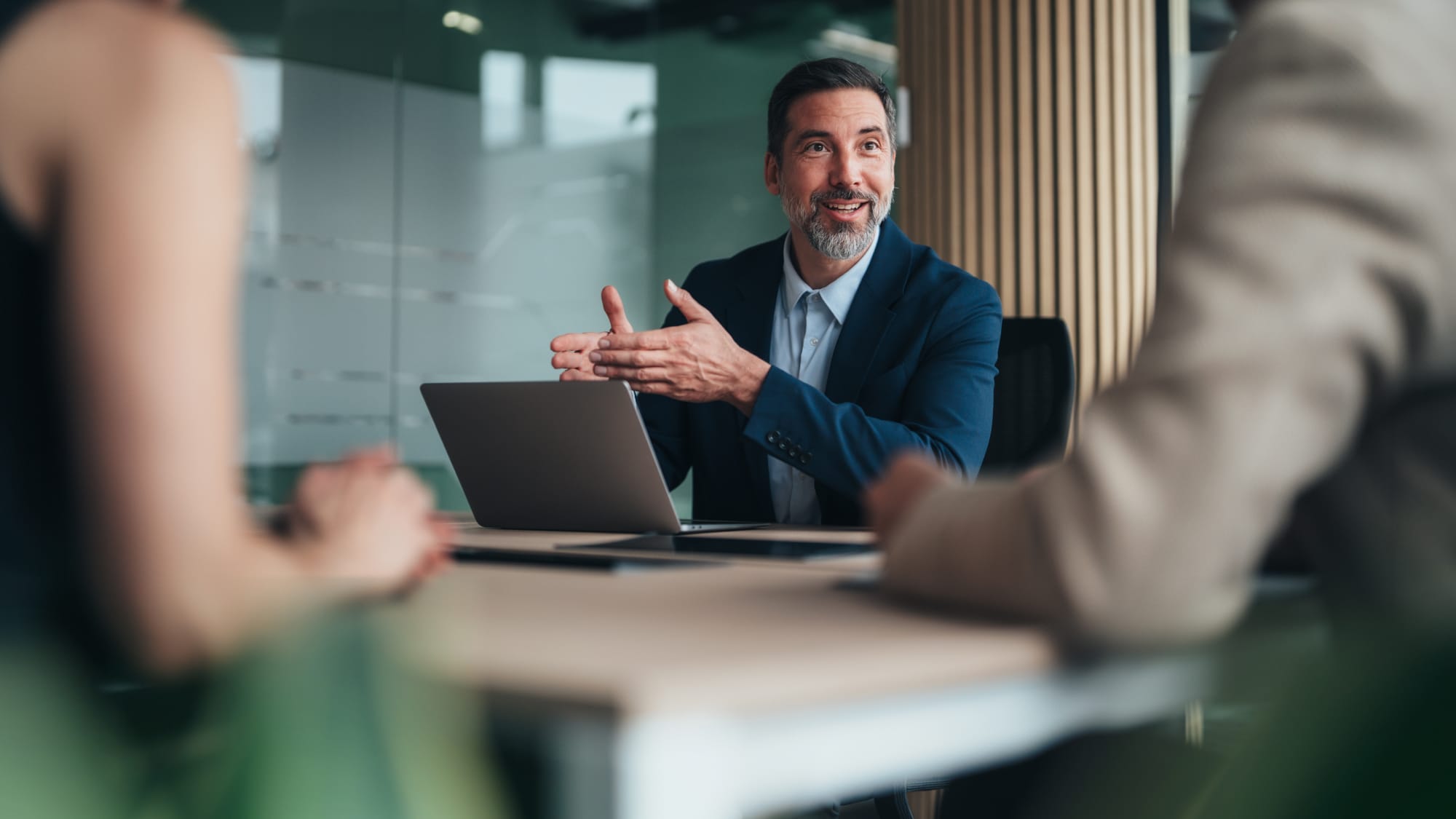 Banking advisor discusses capital requirements and regulatory changes with clients.