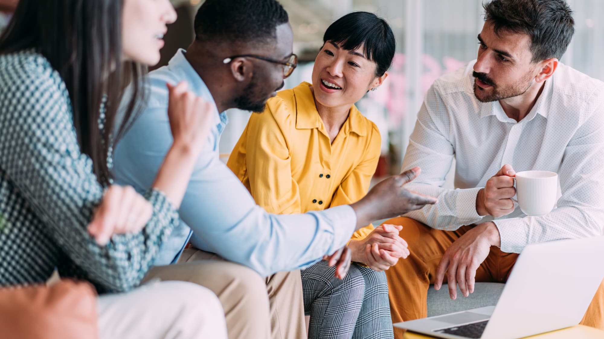 Professionals in discussion at a conference session on banking and credit union trends.