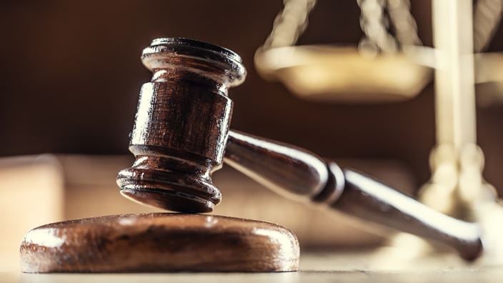 Judge’s gavel and scales representing a federal court ruling on the limited partner exemption