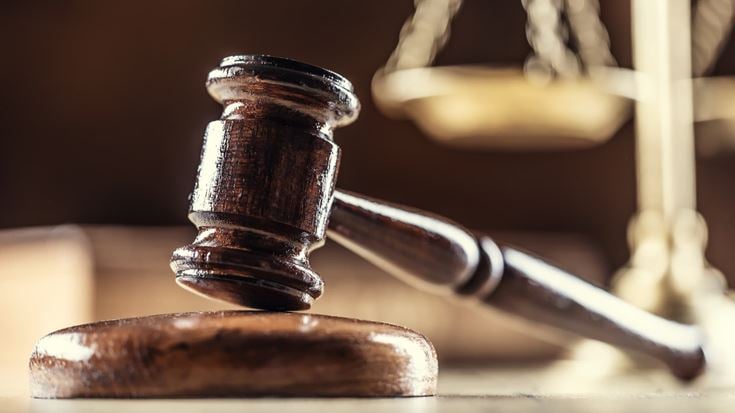Judge’s gavel and scales representing a federal court ruling on the limited partner exemption