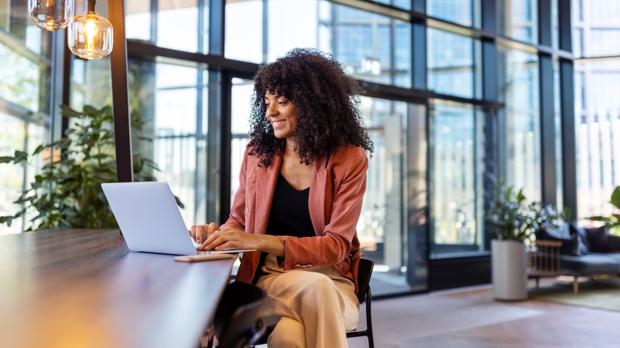 Professional uses Excel on a laptop to build and review a modern tax model.