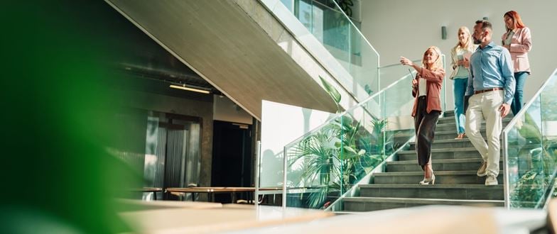 Business professionals collaborate while navigating organizational change.
