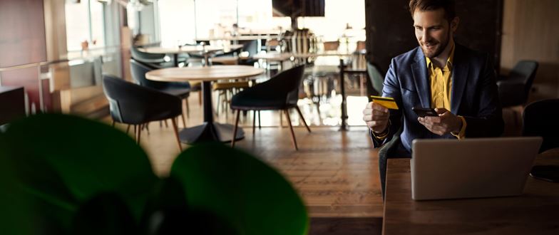 Business professional reviews secure online payment information to support PCI compliance.