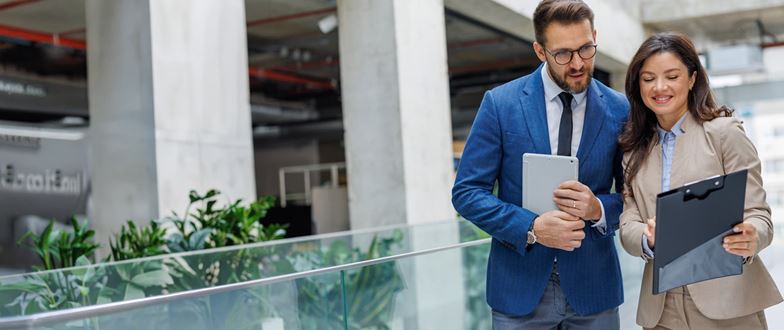 Financial services professionals review information as part of an internal audit.
