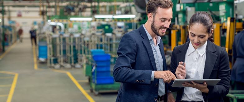 Manufacturing professionals review operations data to identify working capital and cash flow opportunities.