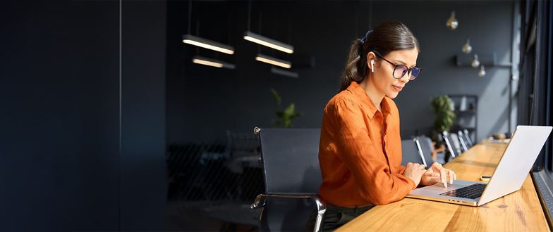 Business professional uses Microsoft technology as part of proactive customer support.