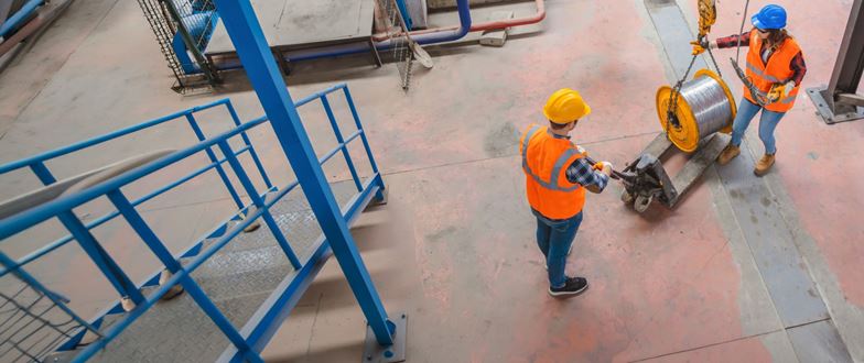 Manufacturing professionals inspect a facility to improve production quality and operational efficiency.