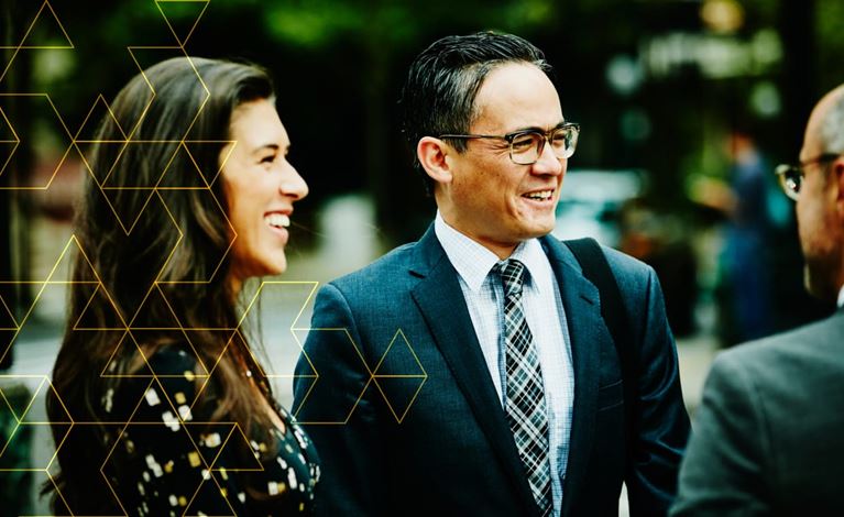 Business professionals connecting and collaborating, reflecting support for employees relocating and working globally.
