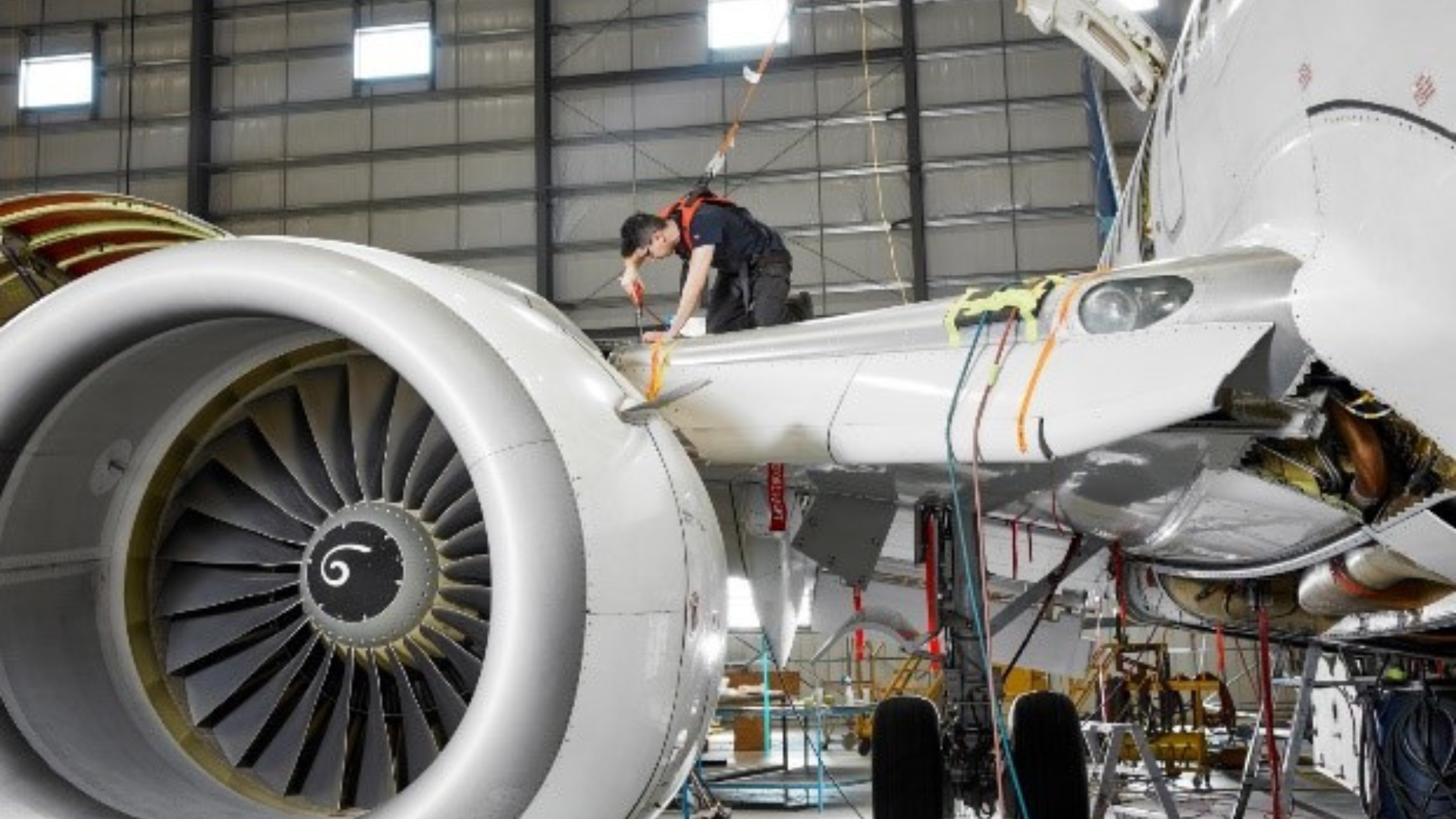 Man repairing an airplane 1920 x 1080
