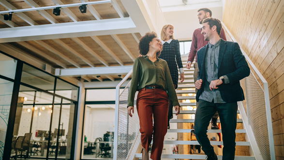 Happy Employees Walking Down Stairs
