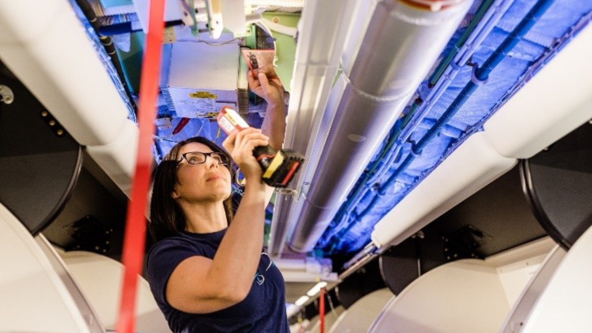Woman repairing an airplane 1920x1080
