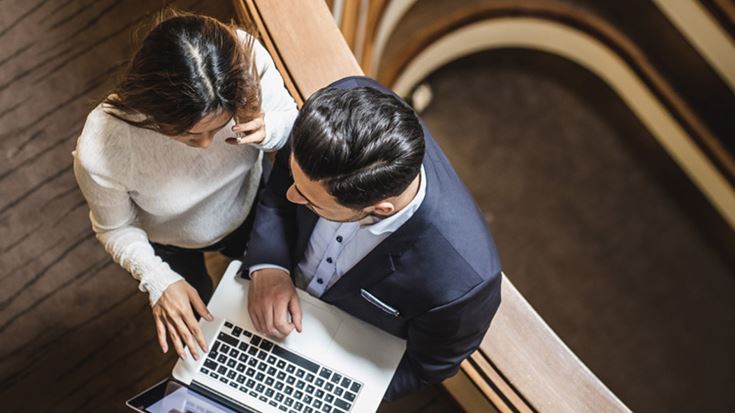 man and woman with laptop