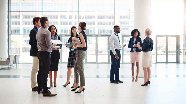 Group of business people standing in foyer
