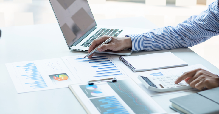 Working on charts at a desk