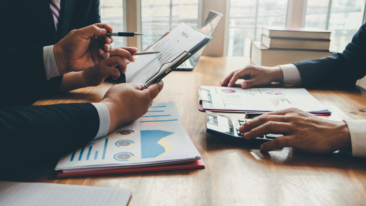 Employees at a table with data