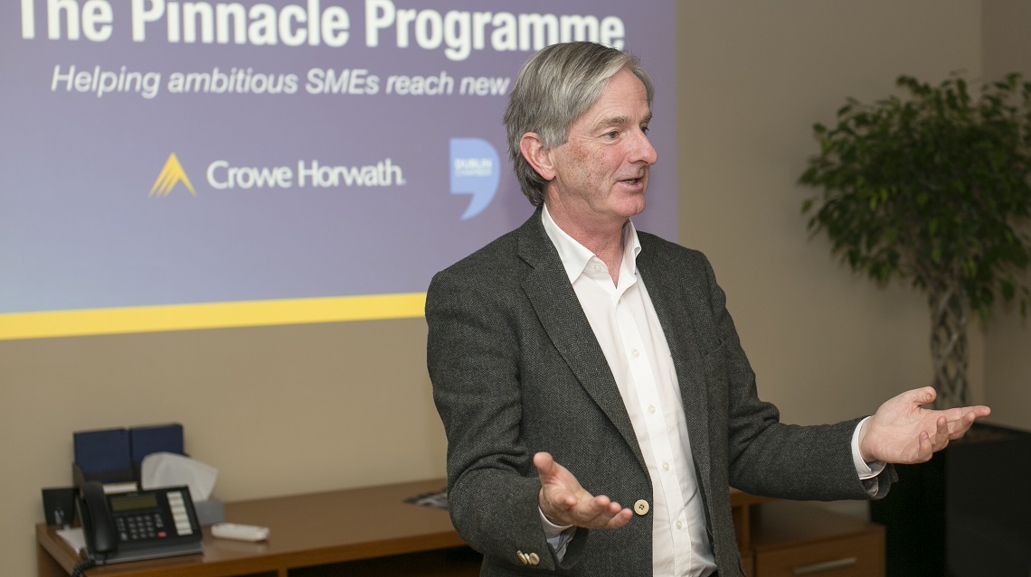 Brody Sweeney speaking at a Crowe leadership event