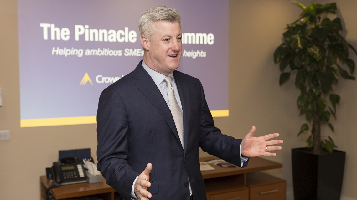 Patrick Kennedy speaking at a Crowe leadership event