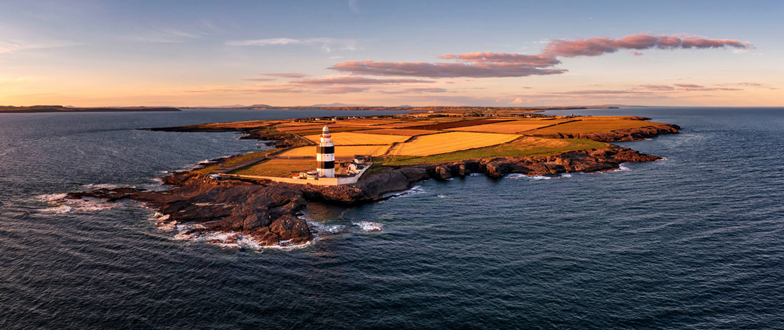 Lighthouse on Irish Coast Hero