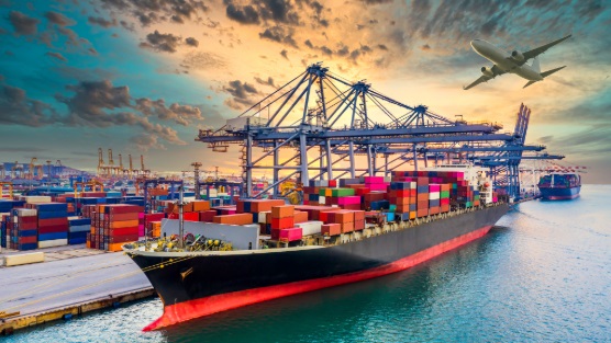A cargo ship in port, loaded with containers