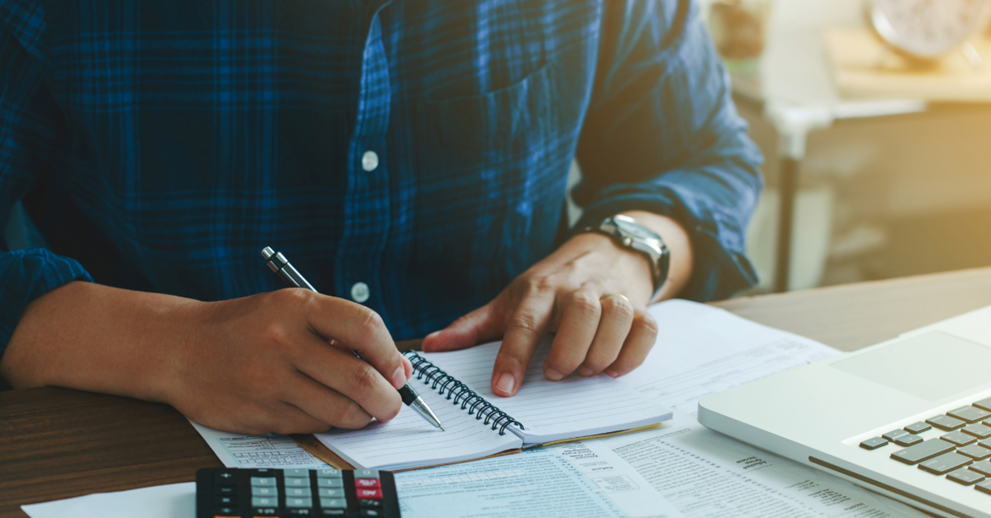 person working at calculator
