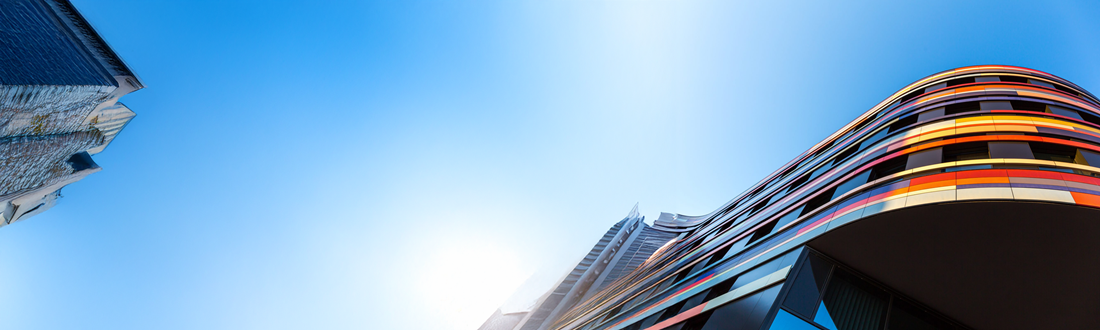 Curved building with sky view