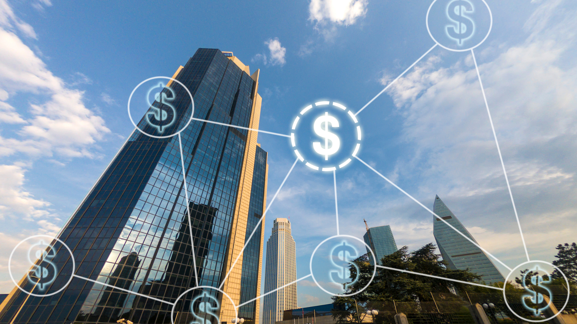 Aerial view of money transfer icon over cityscape