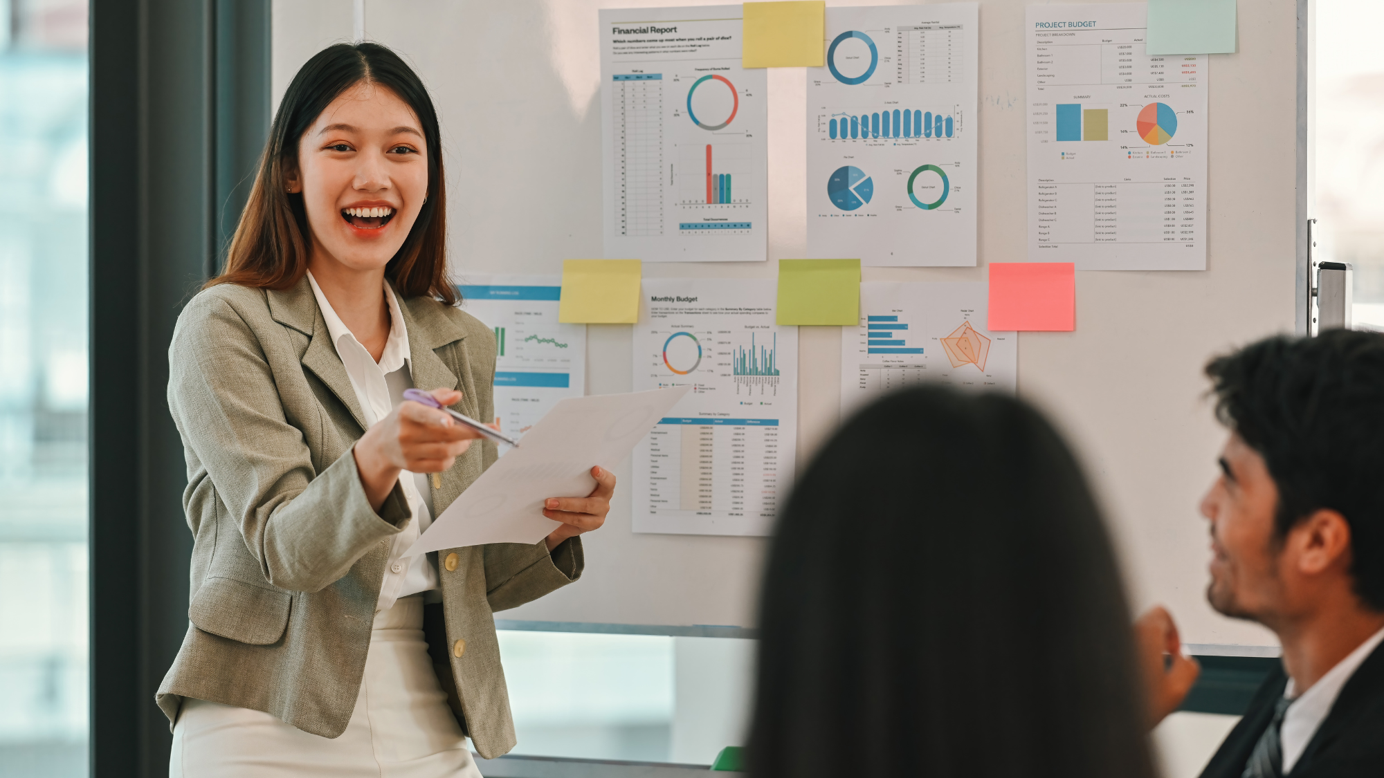 Confident Businesswoman Leading a Team Presentation