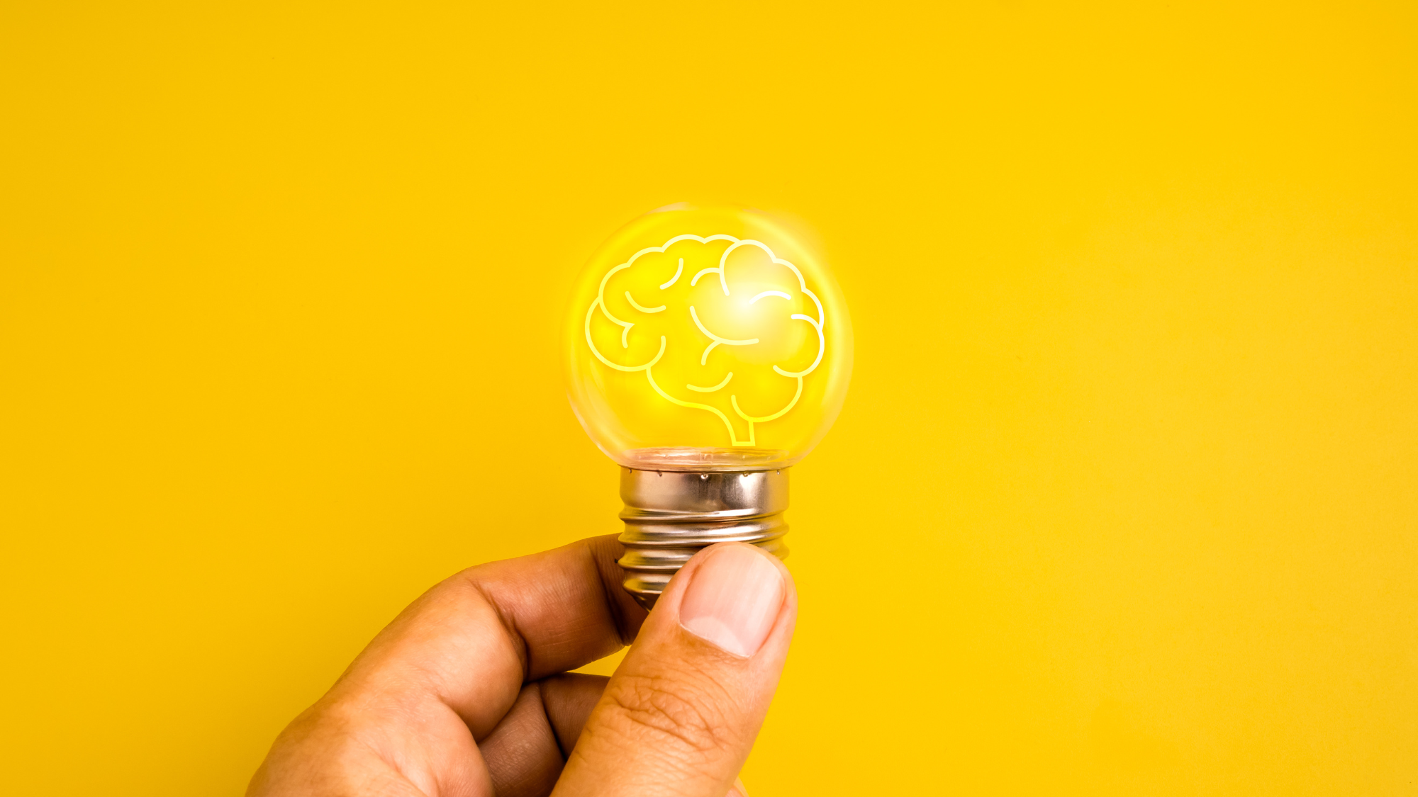 Mental health awareness concept with glowing brain inside light