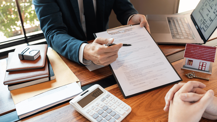 Real Estate Agent Presenting Home Loan