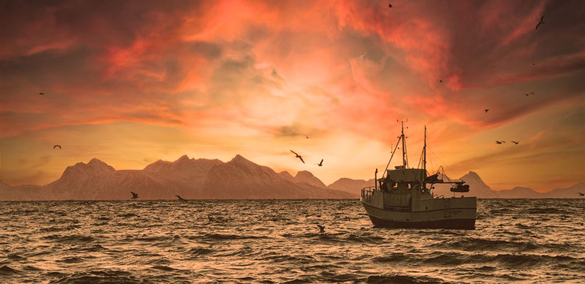 Fishing boat at the sea with mountains in the background. Fishing boat at the sea with mountains in the background.
