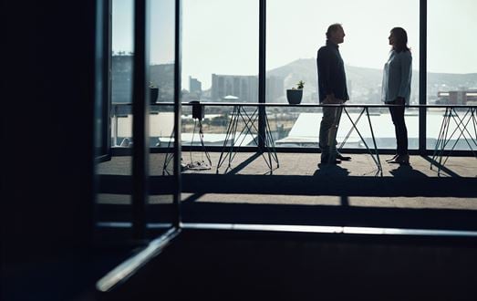 Business people standing in conversation