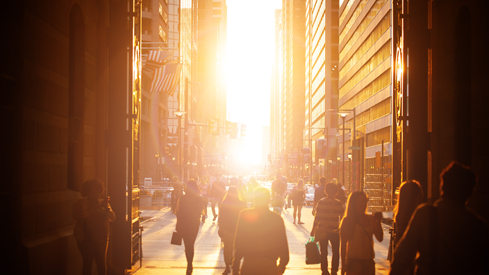 Sunny street with a lot of people