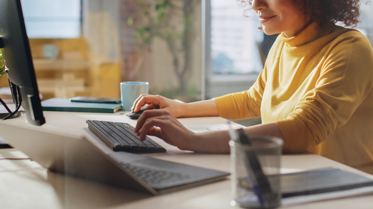 Woman checking on laptop how to safely develop your business abroad