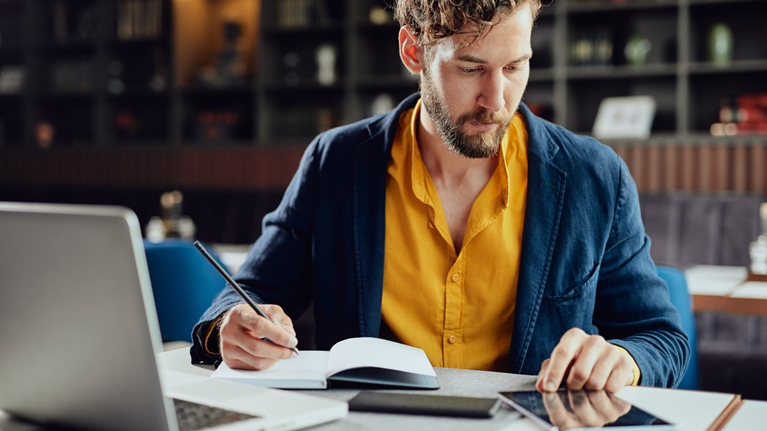 Men checking something on tablet