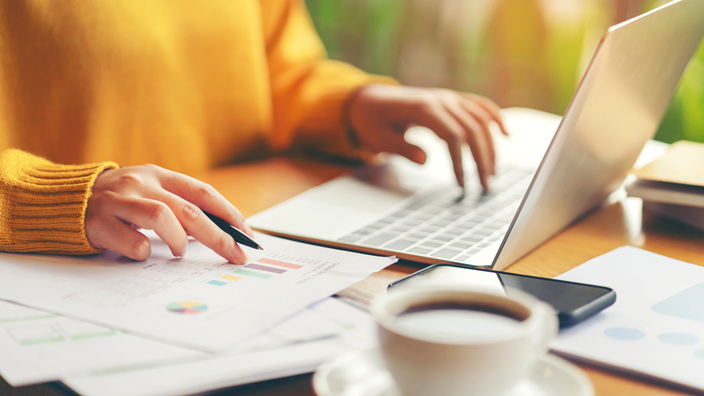 Lady checking the changes in VAT 2026, planned amendments to regulations